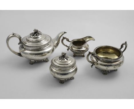 A WILLIAM IV / EARLY VICTORIAN TEA POT, TEA CADDY &amp; SUGAR BOWL with squat circular bodies, gadrooned borders and decorati