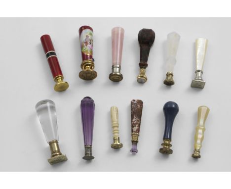 TWELVE ASSORTED SMALL SEALS late 19th / early 20th century with either plated or gilt metal mounts, and handles in various me