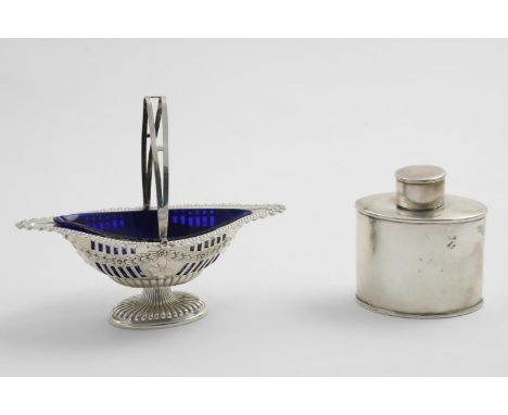 AN EDWARDIAN SWING-HANDLED SUGAR BASKET with pierced and embossed decoration &amp; a blue glass liner, by J. Gloster, Birming