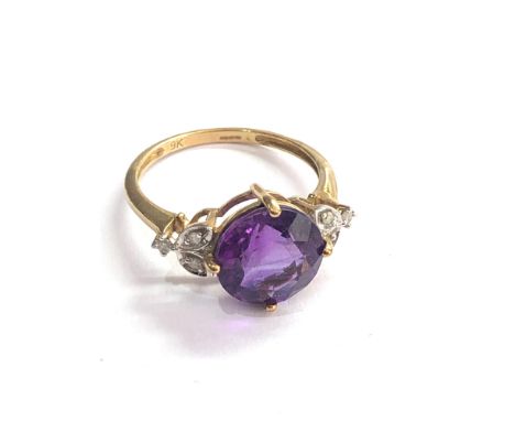 9ct Amethyst ring with floral diamond shoulders weight 2.4g