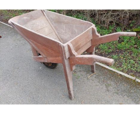 Vintage large wooden wheel barrow measures approx 30 inches high