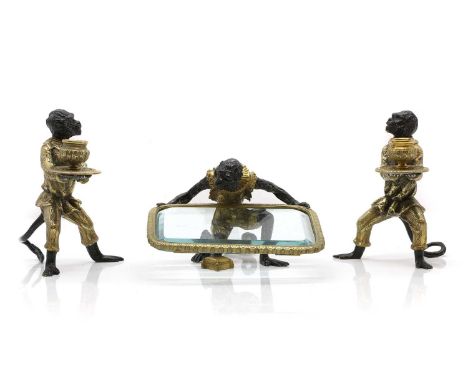 Three ormolu and bronze figures late 19th century, of monkeys, two with candleholders and another with a glass traythe candle