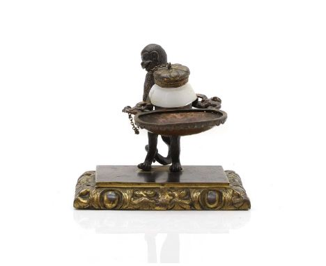 A seated figure of a monkey 19th century, as an inkwell, bronze, on a rectangular base11.5cm wide10cm highCondition ReportLac