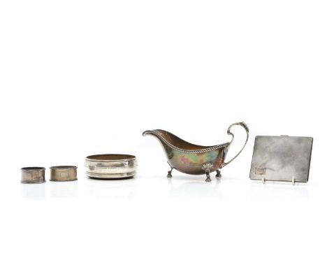 A collection of silver items comprising a sauceboat, Sheffield 1978, 20.5cm wide, a cigarette case, by William Suckling Ltd, 