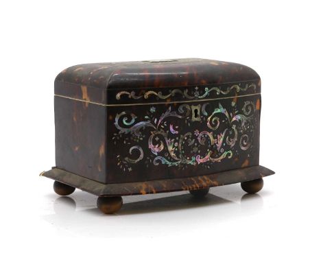 A Regency tortoiseshell tea caddy  c.1830, inlaid with mother of pearl, and with ivory border to internal edge 20cm wide 13.5