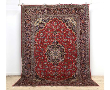 A Persian wool carpet with geometric motifs,341 x 236cmCondition ReportOverall good order with minor wear and surface marks.