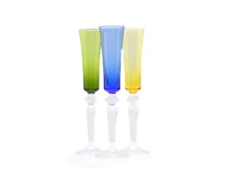 A set of three Baccarat 'Mille Nuits' coloured glass champagne flutes each with a coloured and moulded bowl, acid marks,29.4c