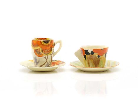 Two Clarice Cliff pottery cups and saucers c.1930, the first of conical form in the 'Lydiat' pattern, printed marks, cup 5.5c