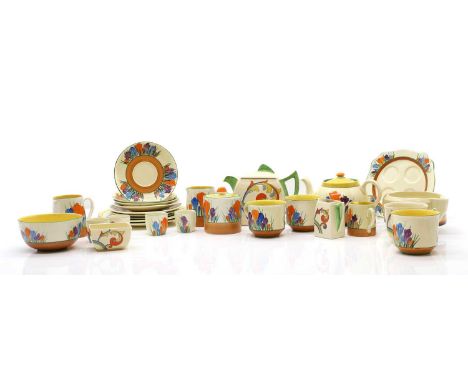 A Clarice Cliff Crocus pattern tea service 1930s, comprising three teacups and saucers, three various cream jugs, the largest
