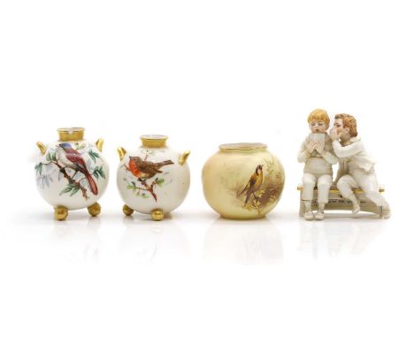 A collection of Royal Worcester porcelain comprising a pair of twin-handled vases, date code 1912, painted with a robin and a