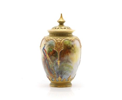 A Royal Worcester porcelain vase and cover by Jack Southall, depicting a peacock on a branch, printed marks, date code 1873, 