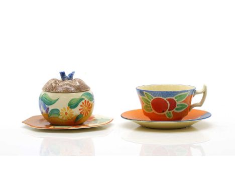 A collection of Clarice Cliff pottery c.1930, comprising a 'Fruit Nuage' pattern cup and saucer, printed marks, cup 11.6cm wi