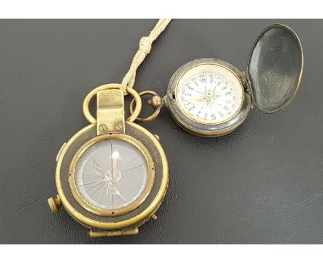 WWI MILITARY MARCHING COMPASSin brass and marked F-L No;126052 1918, together with a brass pocket watch type compass (2) 
