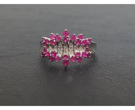 RUBY AND DIAMOND CLUSTER DRESS RINGthe multi round cut diamonds with rubies above and below, on nine carat white gold shank, 