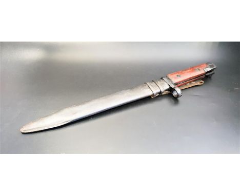 ITALIAN BAYONETwith wood grip and fullered 24.5cm blade, with a metal scabbard 