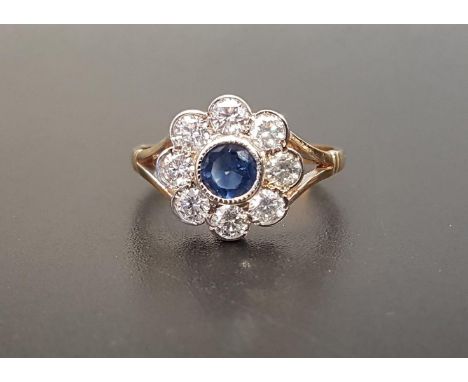 SAPPHIRE AND DIAMOND CLUSTER RING the central bezel set sapphire approximately 0.35cts in eight diamond surround totaling app