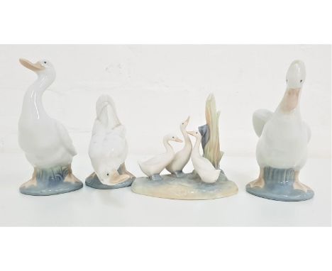 THREE NAO GEESE FIGURINES14.5cm, 15cm and 11cm high, and a Nao group of three geese, 11.5cm high (4) 