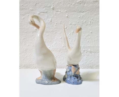 TWO NAO PORCELAIN FIGURINES OF GEESEone preening itself, 23cm high, the other about to take off, 20.5cm high (2) 