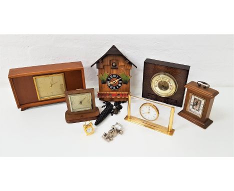 SELECTION OF TIMEPIECESincluding a German cuckoo clock, racing car desk clock, traditional style miniature brass alarm clock,