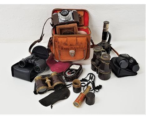 SELECTION OF OPTICAL EQUIPMENTincluding a pair of leather covered field glasses, pair of engine turned brass and leather oper