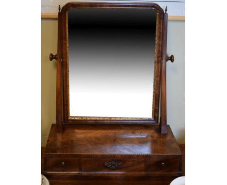 Inlaid walnut swing dressing mirror in the early 18th Century taste, the bevelled mirror plate within cushion-modelled surrou