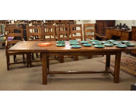 Good quality Wesley Barrell reproduction distressed oak seven piece dining suite comprising: refectory style table fitted two