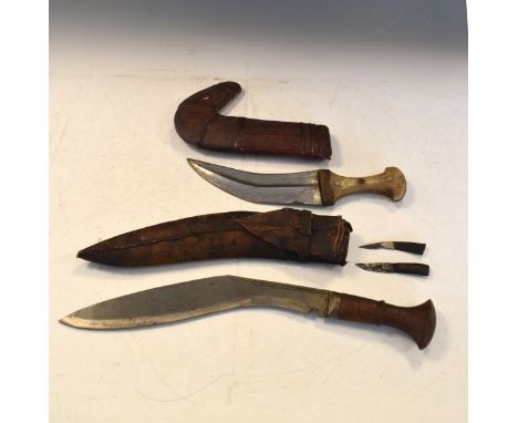 Arab JambIYA, curved double edged blade, horn hilt in a decorative scabbard, together with a Kukri, wooden hilt, curved blade