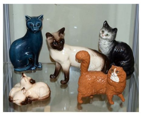 Five ceramic cat figures, three by Beswick, one by Royal Doulton and one by Poole   Condition: 