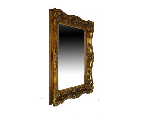 Large modern rectangular wall mirror with bevelled plate within swept gilt frame   Condition: 