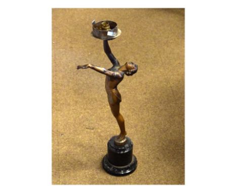 Art Deco bronzed figural lamp base modelled as a semi-naked female figure standing on tip-toe with one arm outstretched, the 