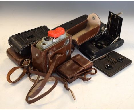 Four vintage folding cameras, a Eumig cine camera and stereoscopic viewer   Condition: 