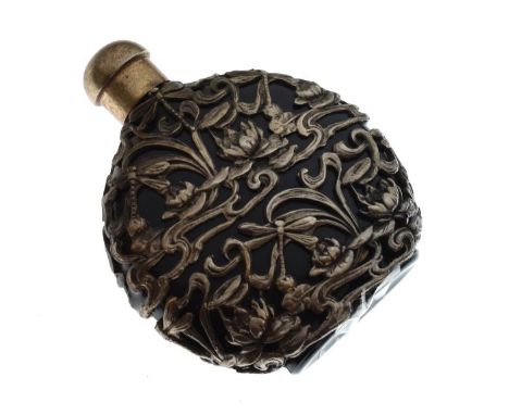 Art Nouveau-style white metal and glass scent bottle, of flask form with cage work decoration including dragonflies and lily 