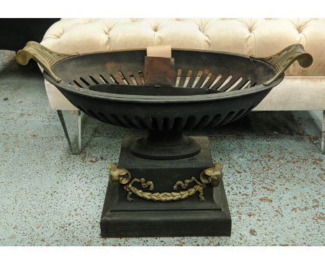 URN FIRE GRATE, 68cm W x 50cm H with an oval shaped pierced basket on a plinth base decorated with ram's head masks and swags