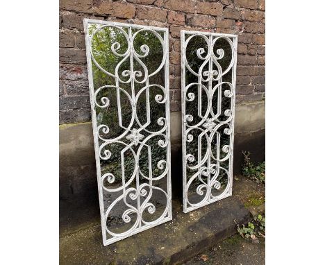 ARCHITECTURAL WALL MIRRORS, a pair, 128cm H x 48cm W, Italian style, aged white painted metal frames, overlaid glazing bars. 