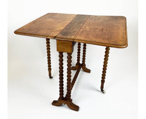 SUTHERLAND TABLE, Victorian walnut on turned bobbin legs and stretcher on original ceramic castors, 70cm L x 60cm W x 60cm H.