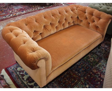 A Victorian velvet upholstered chesterfield sofa