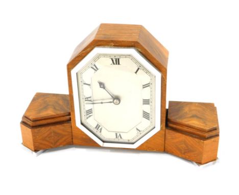 An unusual walnut veneered Art Deco mantel clock, of stepped form, with chrome plated mounts, 34cm wide. 