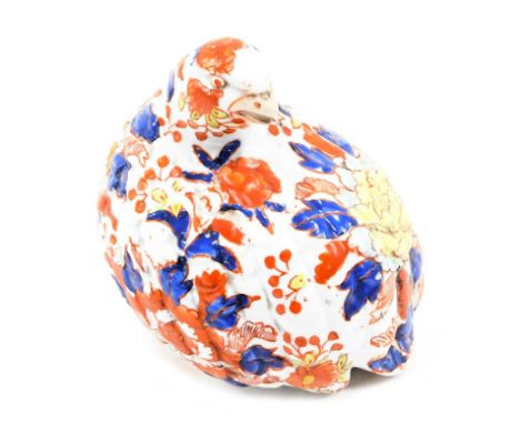 An Oriental ceramic bird, in the Imari painted style, seated with arched neck, with six character stamp to underside, 14cm hi