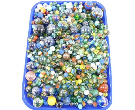 Vintage marbles and a book on marble collecting.