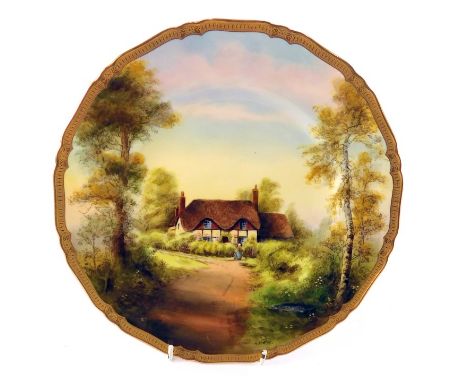 A Royal Worcester porcelain plate, painted with a cottage scene titled Ripple by Michael Ayrton, 27cm diameter.&nbsp;