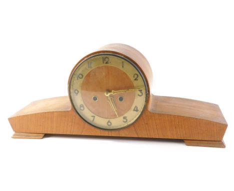 A 1950s light oak cased mantel clock, with gold coloured chapter ring, 50cm wide. 