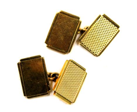 A pair of 9ct gold cufflinks, with rectangular panels each with engine turned decoration, 13.4g all in, in Carmichael's of Hu