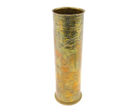 A First World War brass trench art vase, engraved with heraldic lion and mythical creatures beside a caged lion, inscribed in