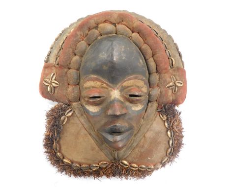 A Dan 'Zakpei' fire marshall mask (with red eyes) with mudcloth/adornments, Cote D'Ivoire, 37cm high.