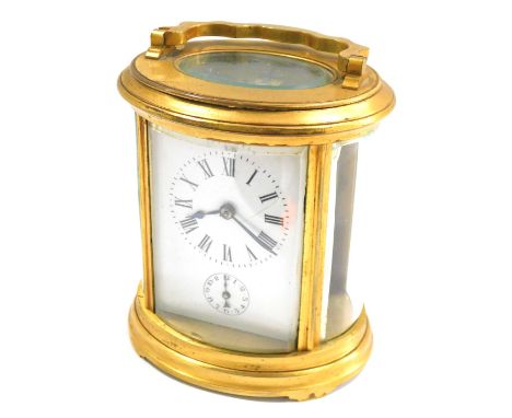A 19thC carriage clock, with gilded border over a white enamel Roman numeric face plate with seconds dial, with a thirty hour