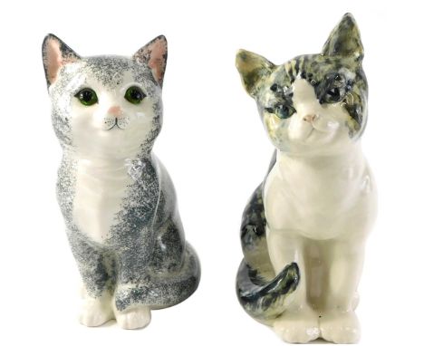 A ceramic Staffordshire Just Cats figure of a seated cat, and another inscribed R.Underwood, 22cm high. 