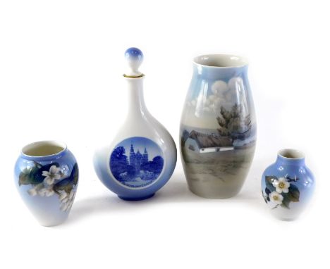 A Royal Copenhagen porcelain vase, decorated with a thatched cottage, 23cm high (AF), a decanter decorated with a scene of Ro