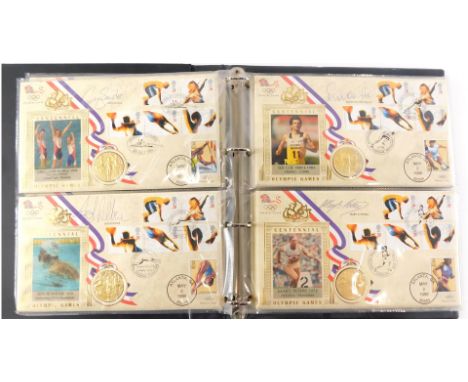 An album of 1996 Olympic Games first day coin covers, each inset with a gold medallion and signed by various previous gold me