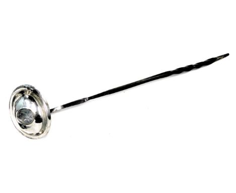 A George III silver toddy ladle, with shaped boat handle inset with George III 1787 half crown, on an ebony twist stem, 34cm 