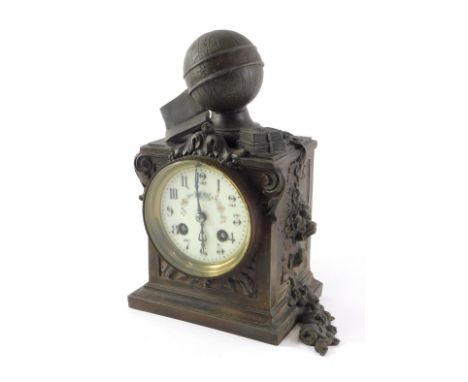 A 19thC bronzed spelter mantel clock, mounted with a globe with a painted dial, 25cm high. 